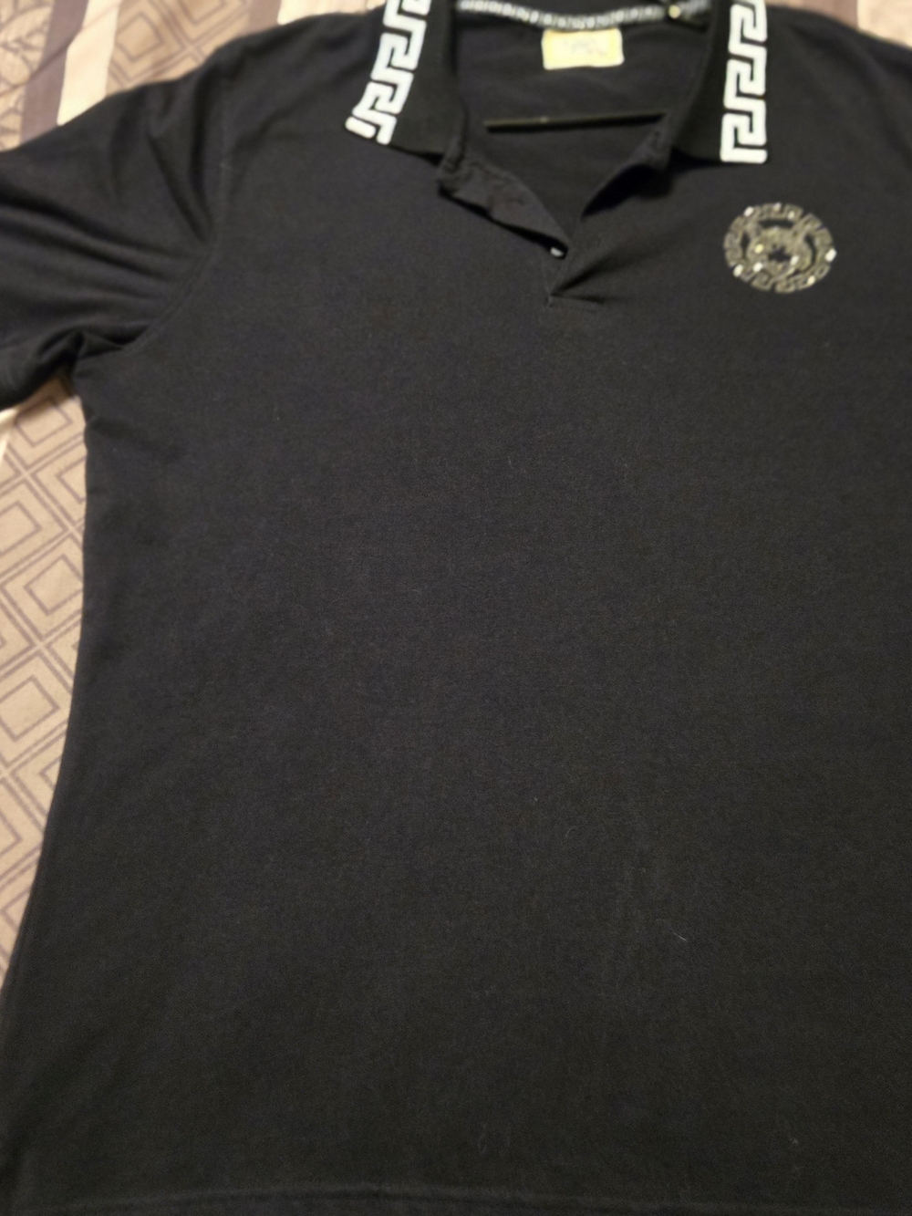 Black Polo Shirt with Decorative Collar and Chest Emblem